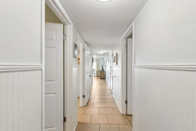 a view of a hallway with a wooden space