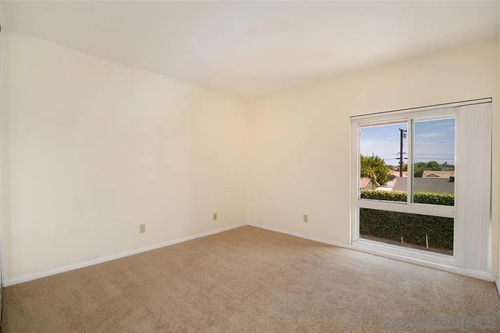 6555 Mt Ada Road, Unit 222 San Diego, CA 92111 - Photo 10 of 12 an empty room with a fireplace