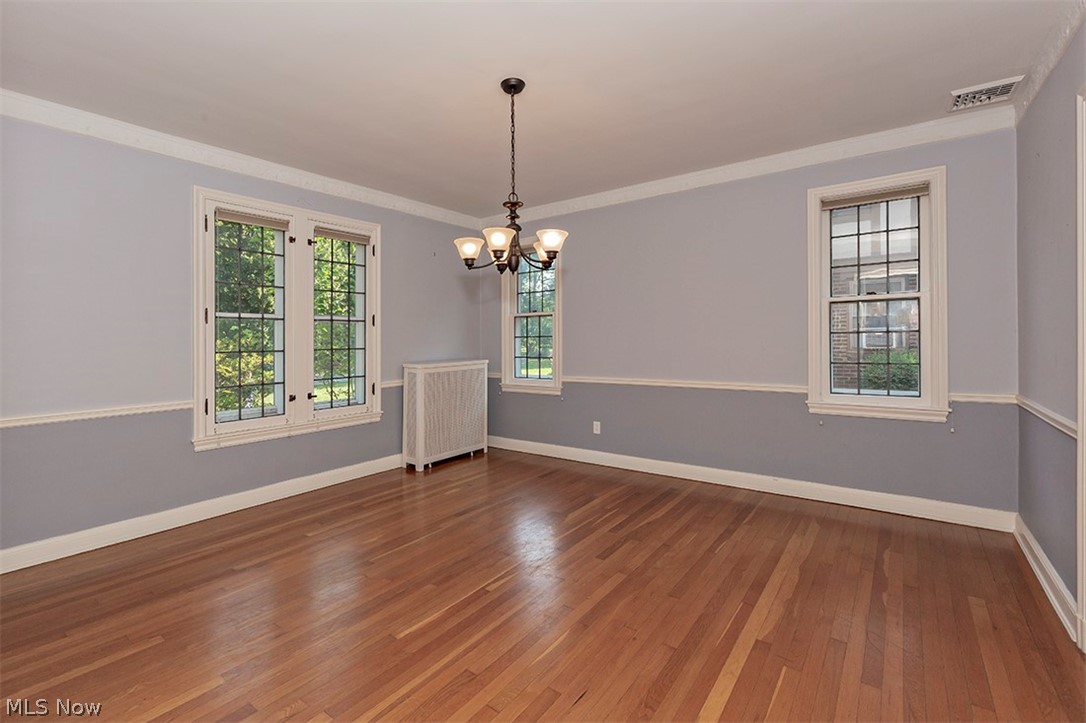 2830 East Overlook Road Cleveland, OH 44118 - Photo 13 of 32 Leaded glass windows showcase the Formal Dining Room. Hardwood floors, chair rail. In the left corner is the radiator, providing hot water heat, and in the ceiling on the top right corner is an air conditioning vent !