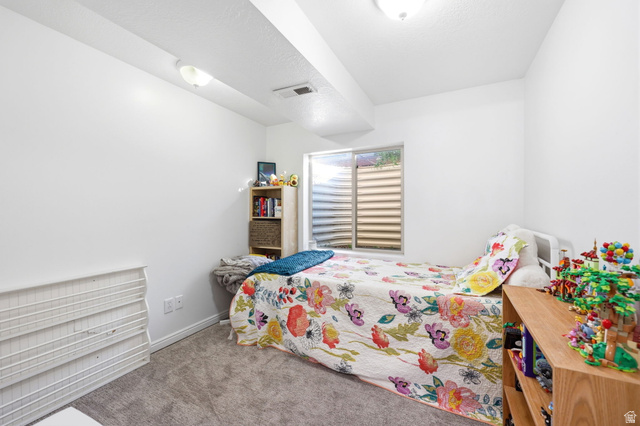 1662 East Ridgefield Road Spanish Fork, UT 84660 - Photo 12 of 18 Bright interior space featuring a window with horizontal blinds, neutral wall paint, and recessed ceiling lighting