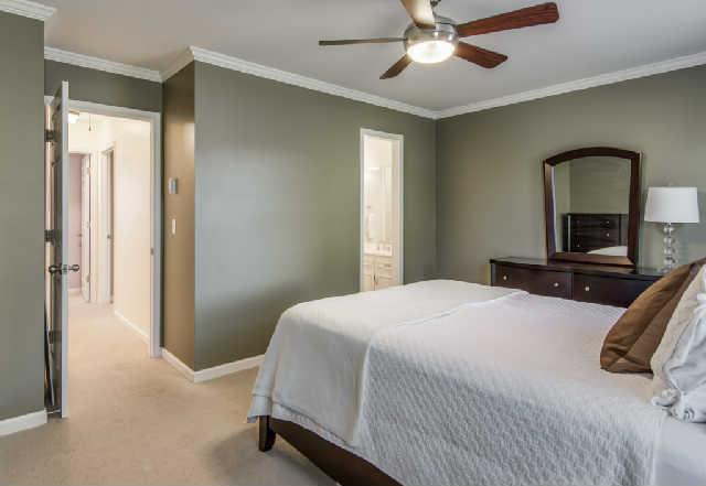 892 General George Patton Road, Unit 892 Nashville, TN 37221 - Photo 14 of 20 a bedroom with a bed and a chandelier