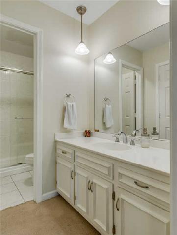 892 General George Patton Road, Unit 892 Nashville, TN 37221 - Photo 15 of 20 a bathroom with a double vanity sink mirror and double