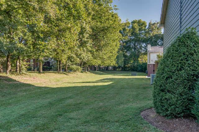 892 General George Patton Road, Unit 892 Nashville, TN 37221 - Photo 19 of 20 a view of a house with a yard