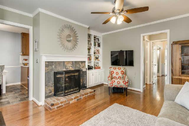 892 General George Patton Road, Unit 892 Nashville, TN 37221 - Photo 10 of 20 a living room with furniture fireplace and flat screen tv