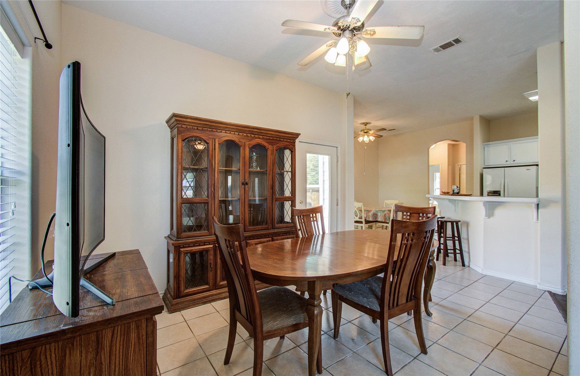 10822 Sail View Street Montgomery, TX 77356 - Photo 11 of 29 a view of a dining room with furniture and a chandelier