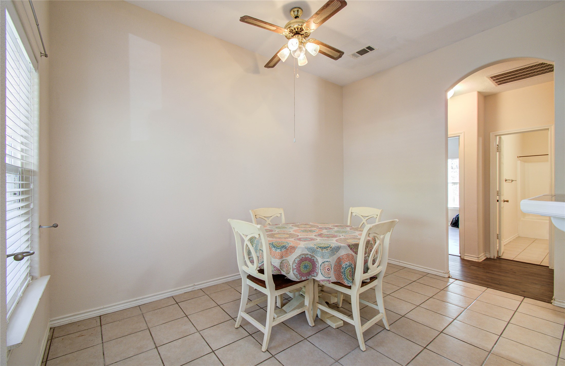 10822 Sail View Street Montgomery, TX 77356 - Photo 12 of 29 a view of a dining room with furniture and a chandelier fan