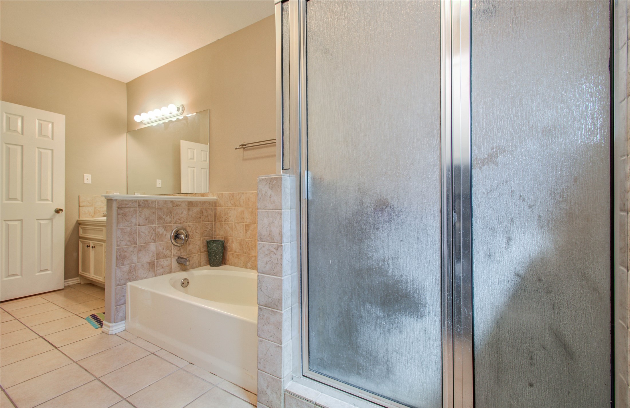 10822 Sail View Street Montgomery, TX 77356 - Photo 26 of 29 a bathroom with a bathtub and a shower