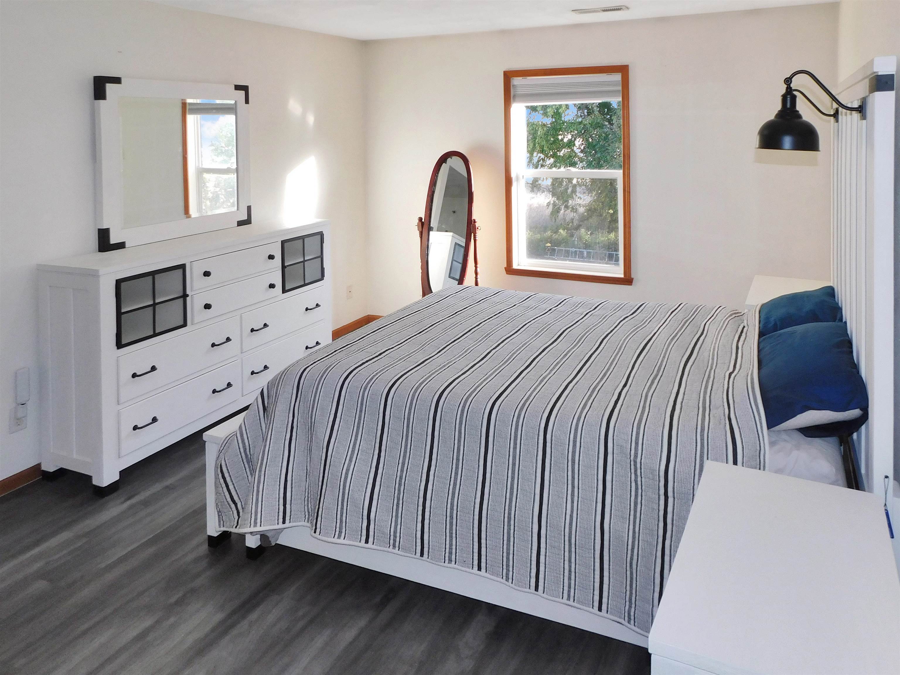 558 Mosaic Lane, Unit 1 Roscoe, IL 61073 - Photo 21 of 28 a bedroom with a bed and a dresser