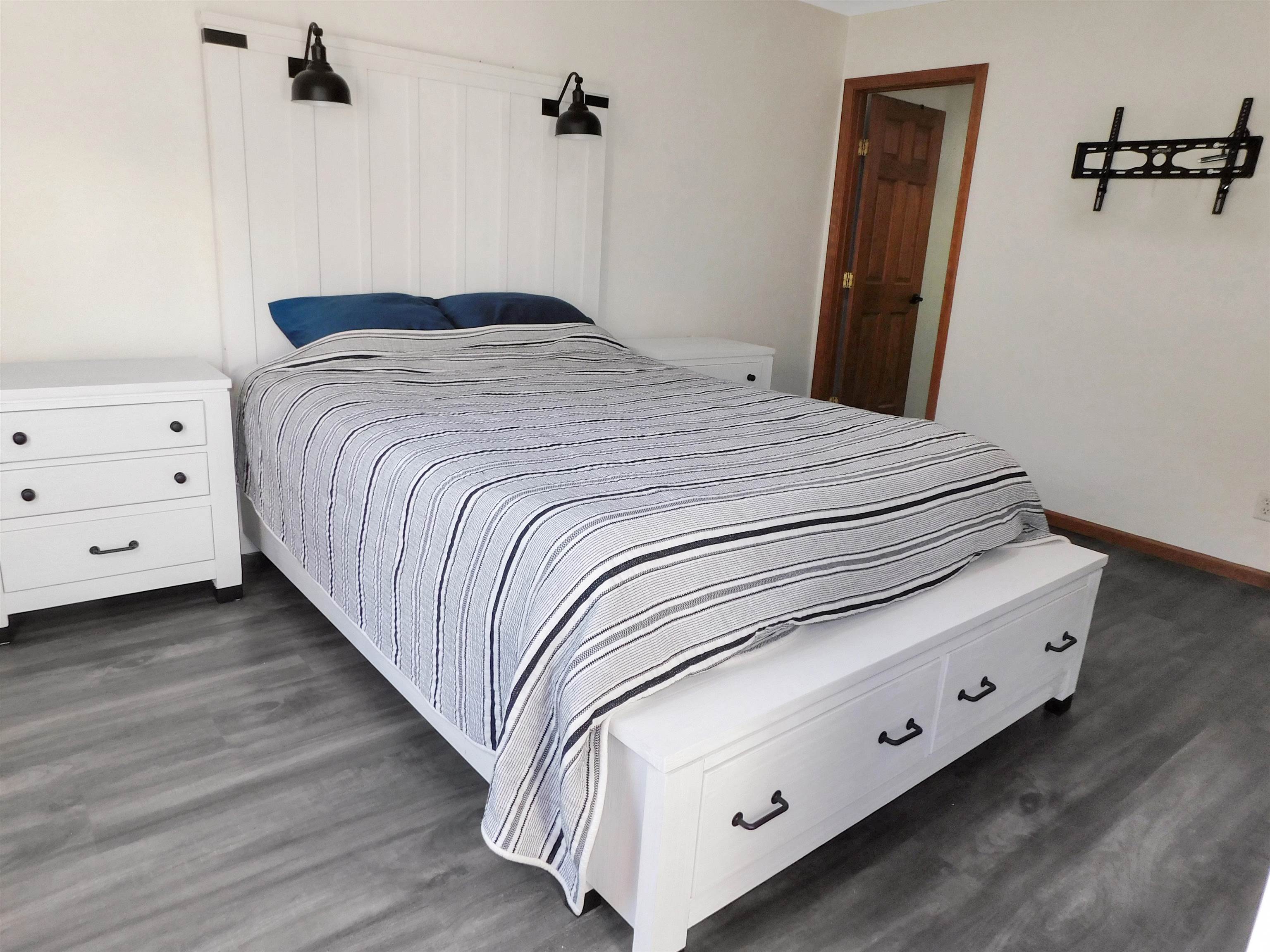 558 Mosaic Lane, Unit 1 Roscoe, IL 61073 - Photo 22 of 28 a bedroom with a bed and a night stand