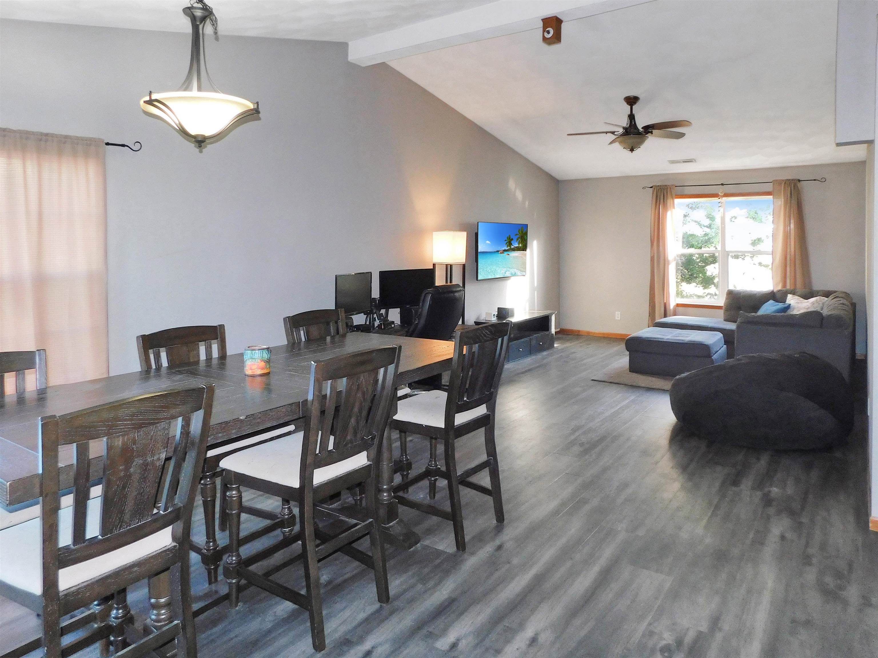 558 Mosaic Lane, Unit 1 Roscoe, IL 61073 - Photo 4 of 28 a view of a livingroom with furniture window and wooden floor