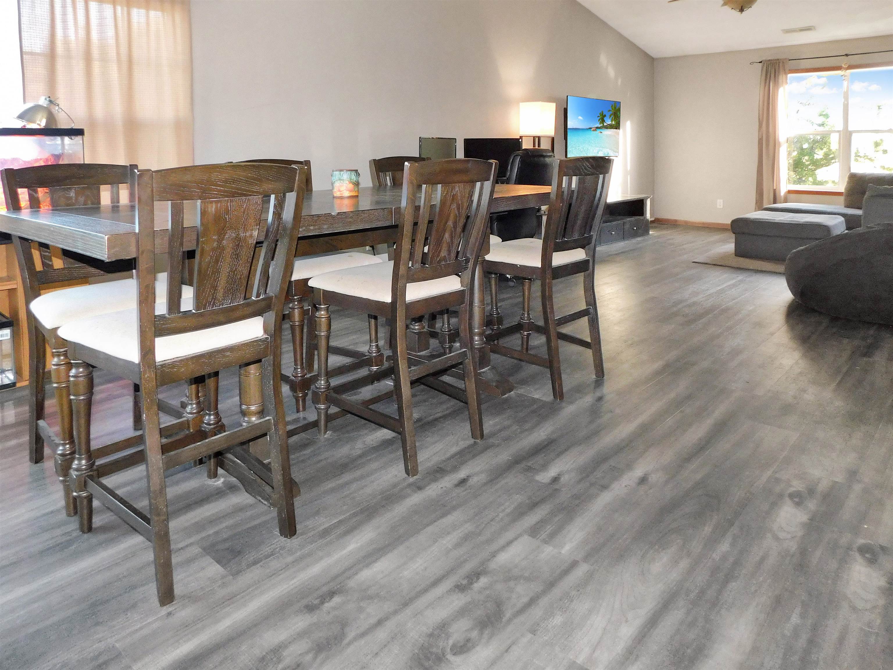 558 Mosaic Lane, Unit 1 Roscoe, IL 61073 - Photo 5 of 28 a view of a dining room with furniture and a window