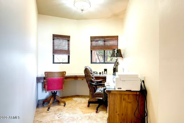 a view of a workspace with furniture