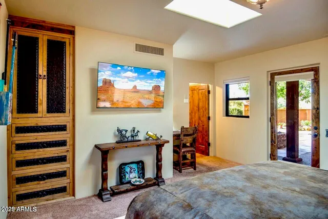 a bedroom with furniture and a fireplace