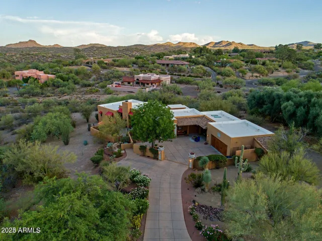 an aerial view of a house with mountain view