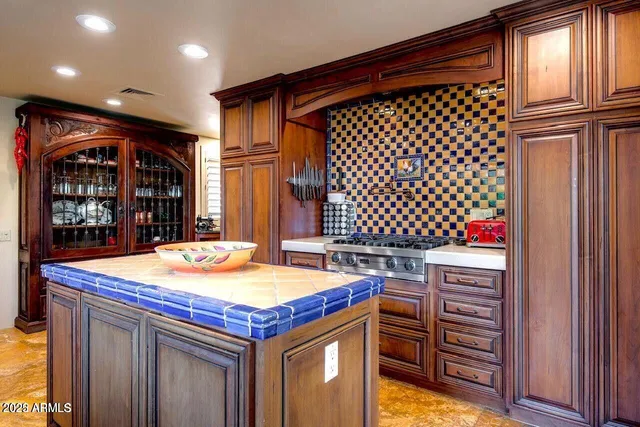 a kitchen with a sink and cabinets