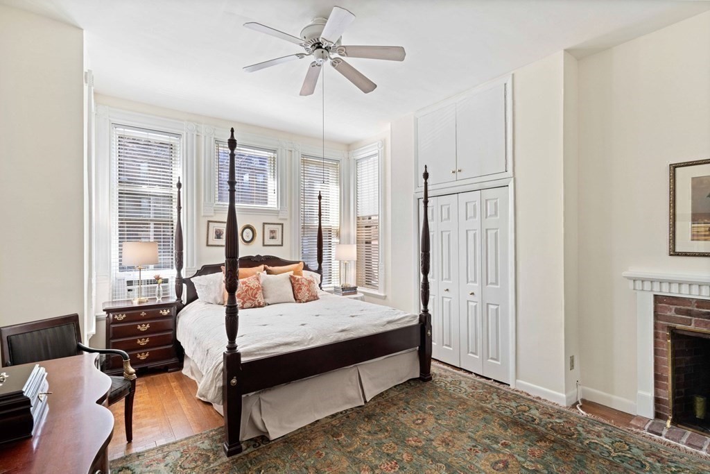226 Commonwealth Avenue, Unit 1 Boston, MA 02116 - Photo 7 of 17 a bedroom with a bed couch and a window