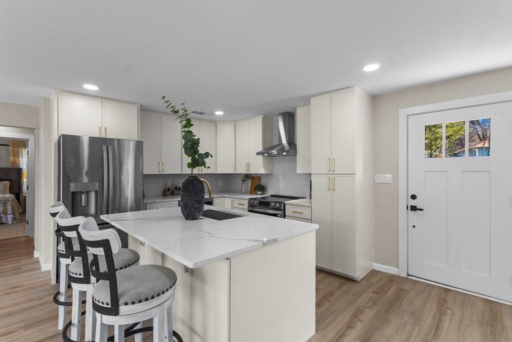 2155 Hickory Trace Mabank, TX 75156 - Photo 11 of 40 a kitchen with refrigerator and chairs