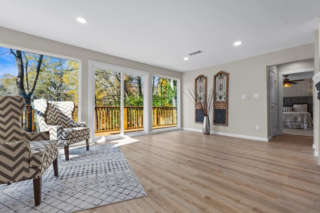 2155 Hickory Trace Mabank, TX 75156 - Photo 16 of 40 a living room with furniture and large windows