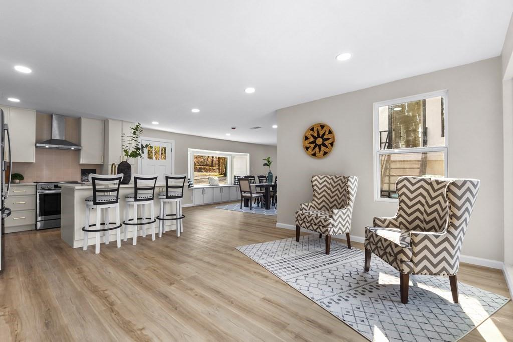 2155 Hickory Trace Mabank, TX 75156 - Photo 17 of 40 a living room with furniture and wooden floor
