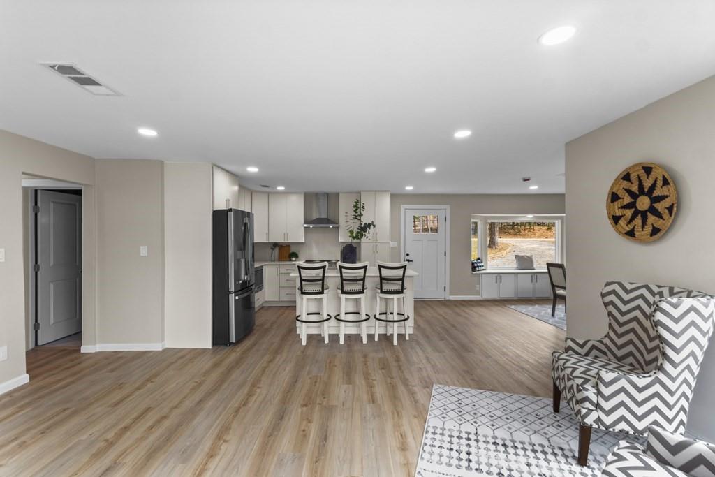 2155 Hickory Trace Mabank, TX 75156 - Photo 19 of 40 a living room with furniture and kitchen view