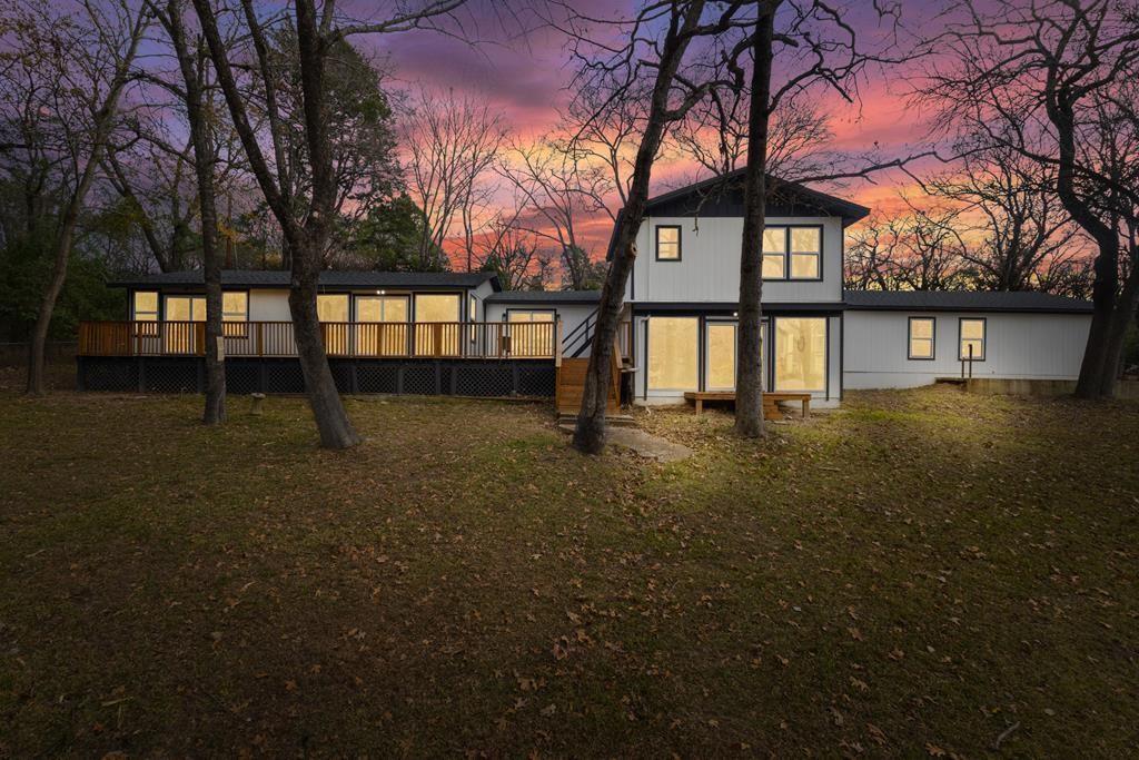 2155 Hickory Trace Mabank, TX 75156 - Photo 2 of 40 a front view of a house with a yard