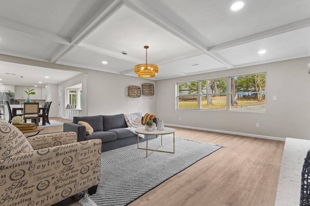2155 Hickory Trace Mabank, TX 75156 - Photo 26 of 40 a living room with furniture and a chandelier