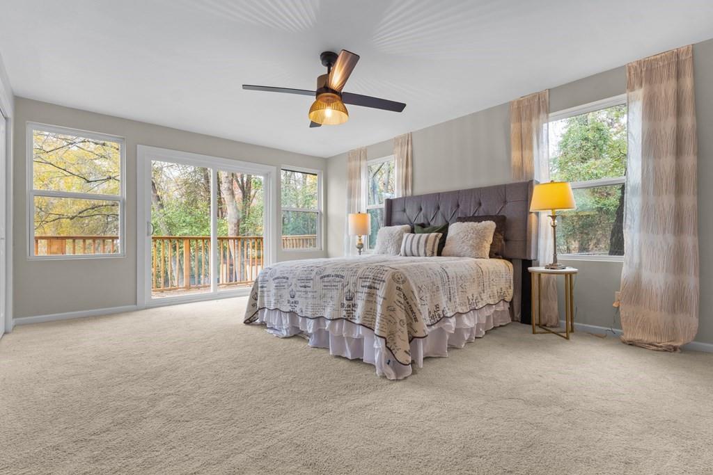 2155 Hickory Trace Mabank, TX 75156 - Photo 28 of 40 a bedroom with a large bed and a large window