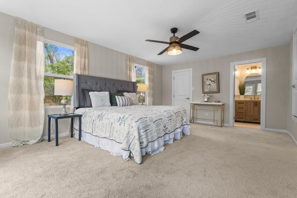 2155 Hickory Trace Mabank, TX 75156 - Photo 29 of 40 a bedroom with a large bed and windows