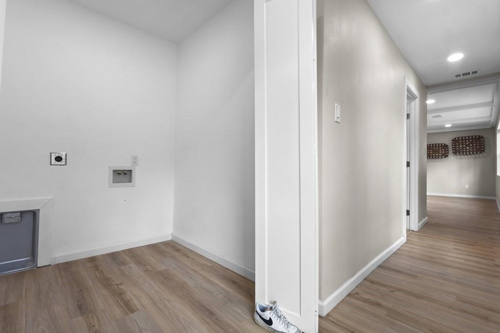 2155 Hickory Trace Mabank, TX 75156 - Photo 37 of 40 a view of a hallway with wooden floor