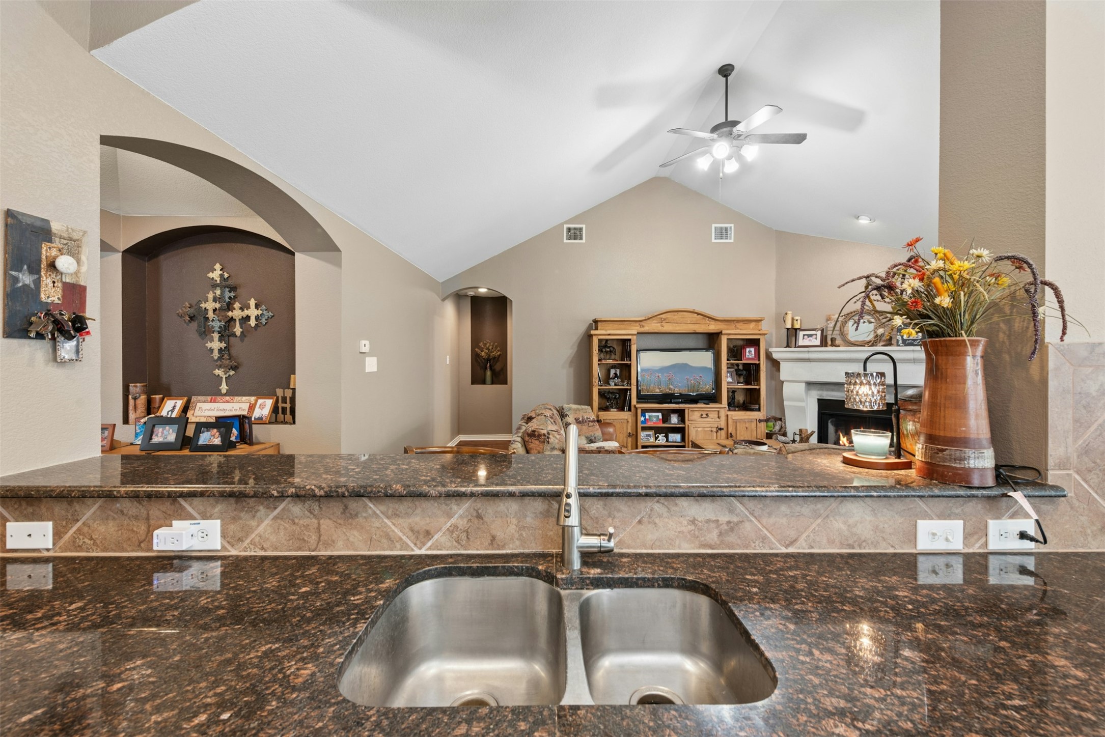 30013 Edgewood Drive Georgetown, TX 78628 - Photo 12 of 39 View into the Family Room. The kitchen features a double stainless steel sink and granite countertops with a tiled backsplash