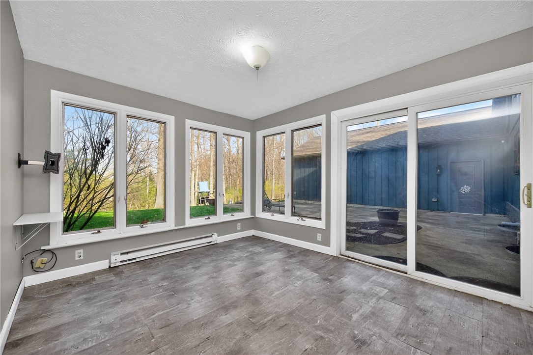 4747 Fawnwood Road Dayton, OH 45429 - Photo 25 of 58 This bright sunroom features expansive windows and durable flooring, perfect for relaxation or entertaining.