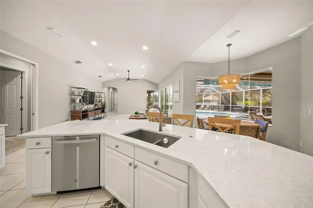 a bathroom with a double vanity sink a toilet and a mirror