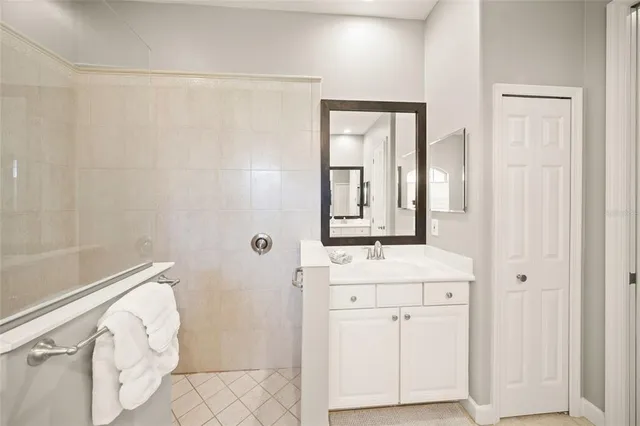 a view of a livingroom with furniture and floor to ceiling window