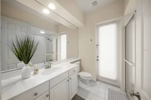 a view of a house with backyard sitting area and porch