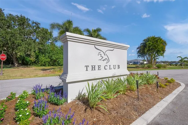 an aerial view of a house with a lake view