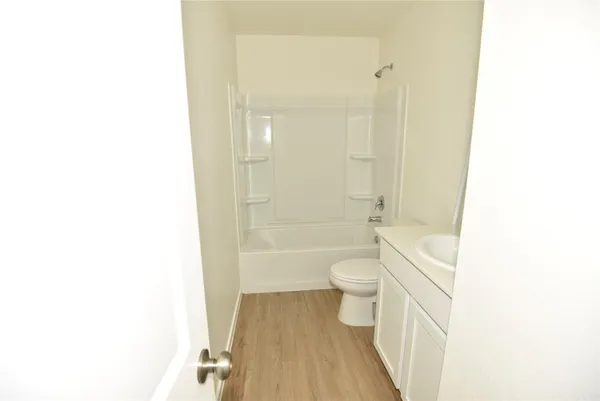a bathroom with a toilet and a bathtub