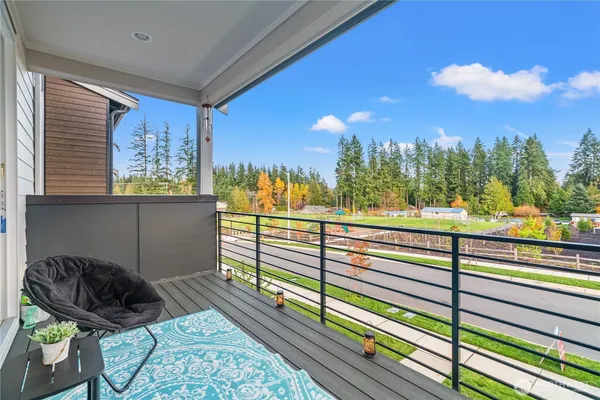 a kitchen with stainless steel appliances granite countertop a refrigerator a stove and a wooden floors