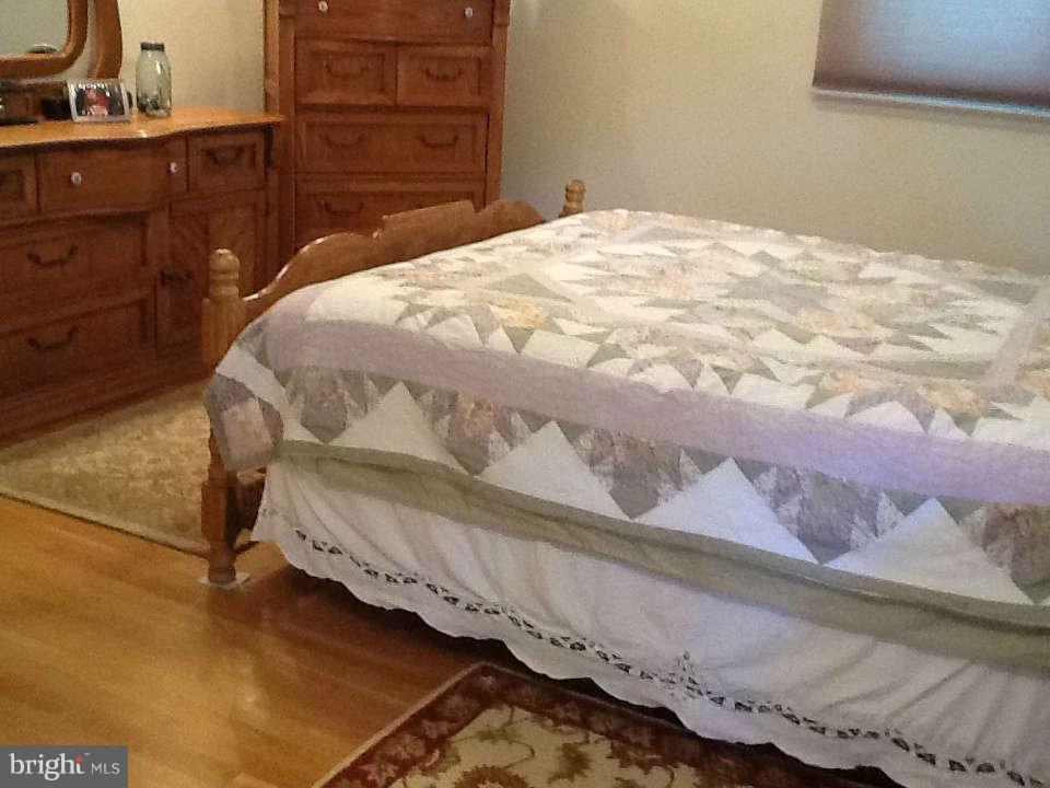 617 Southmont Road Baltimore, MD 21228 - Photo 10 of 29 Master bedroom with exposed hardwood floors