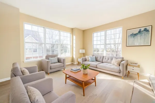 a living room with furniture and a large window