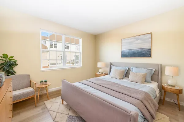 a bedroom with a bed and a couch