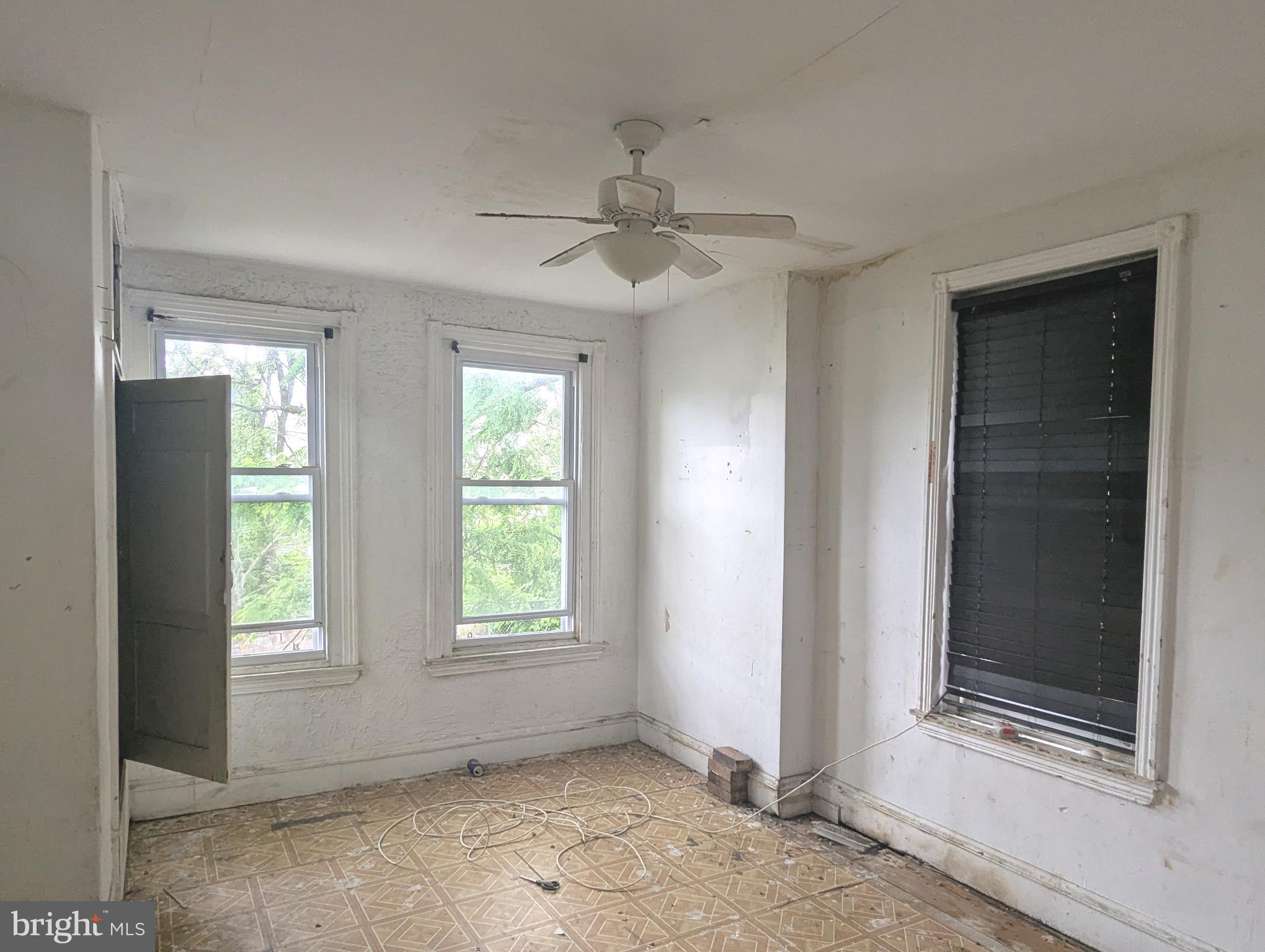 3838 Cambridge Street Philadelphia, PA 19104 - Photo 2 of 10 an empty room with windows and closet
