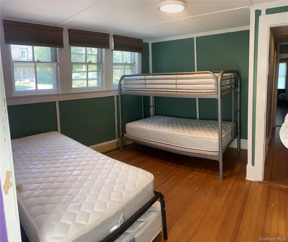 a view of a patio with furniture and garden