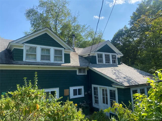 a house view with a garden space