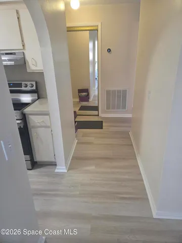 a bathroom with a toilet and a shower curtain
