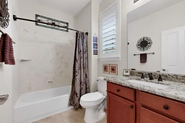 a view of bathroom with a toilet sink and mirror