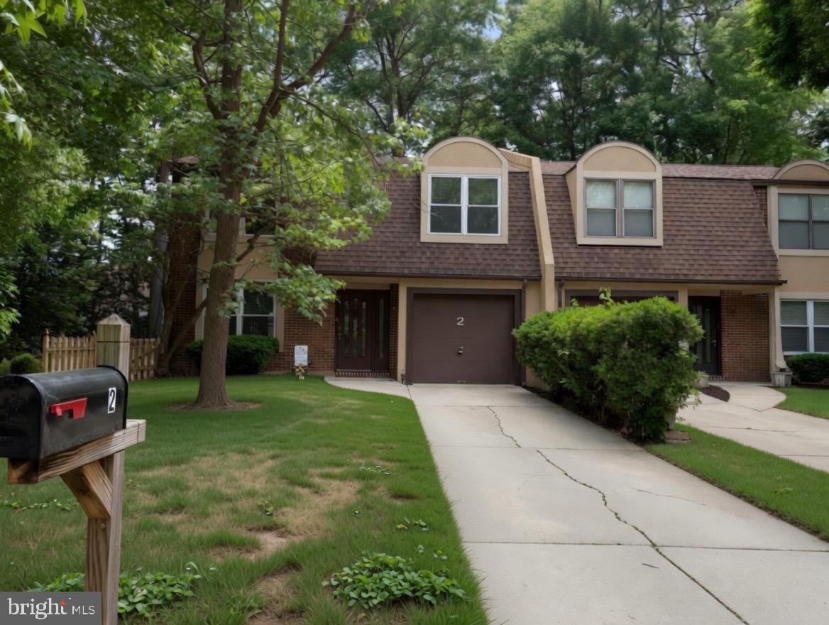 2 Goshawk Court Voorhees, NJ 08043 - Photo 1 of 33 a front view of a house with a yard and trees