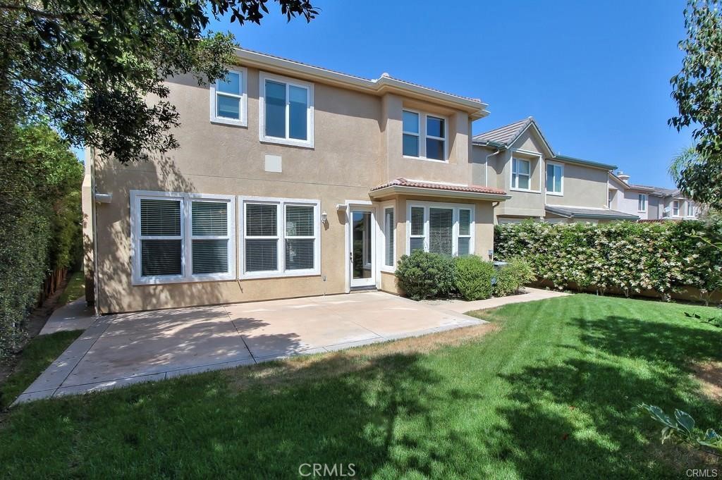 11516 Venezia Way Porter Ranch, CA 91326 - Photo 3 of 35 a front view of a house with a garden