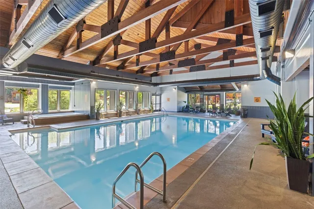 a view of swimming pool with outdoor seating