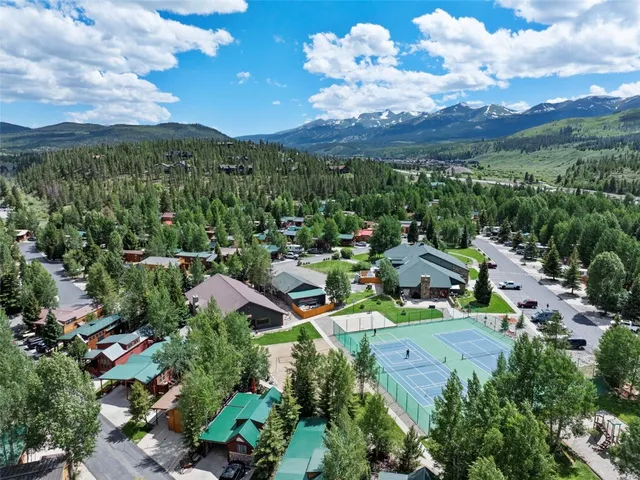 a view of a city with lots of residential buildings and mountain view in back