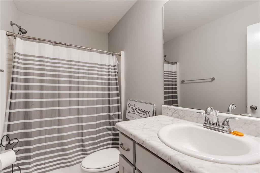 227 Waters Edge Parkway Temple, GA 30179 - Photo 11 of 26 a bathroom with a sink toilet and shower
